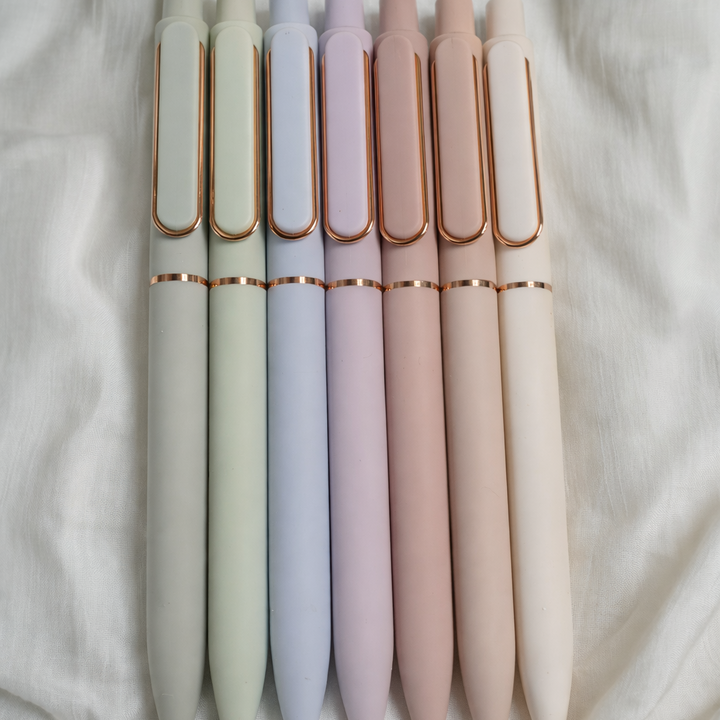 Set of colorful pens on a soft fabric background