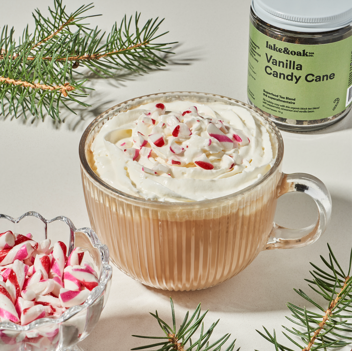 Glass jar of Vanilla Candy Cane loose-leaf tea by Lake &amp; Oak Tea Co. with a clear view of the tea leaves inside.