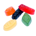 Colorful candy tablets with visible branding on a white background