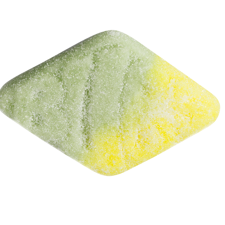 Green and yellow bath bomb on a white background