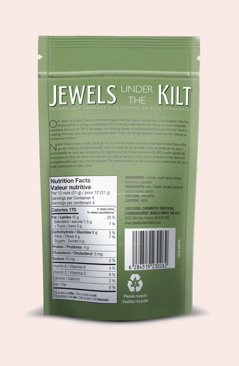 A green stand-up pouch of 'Jewels Under The Kilt' macadamia nut butter, shown from the back on a light pink background. The packaging features white text, a nutrition facts panel, a barcode, and a recycling symbol.