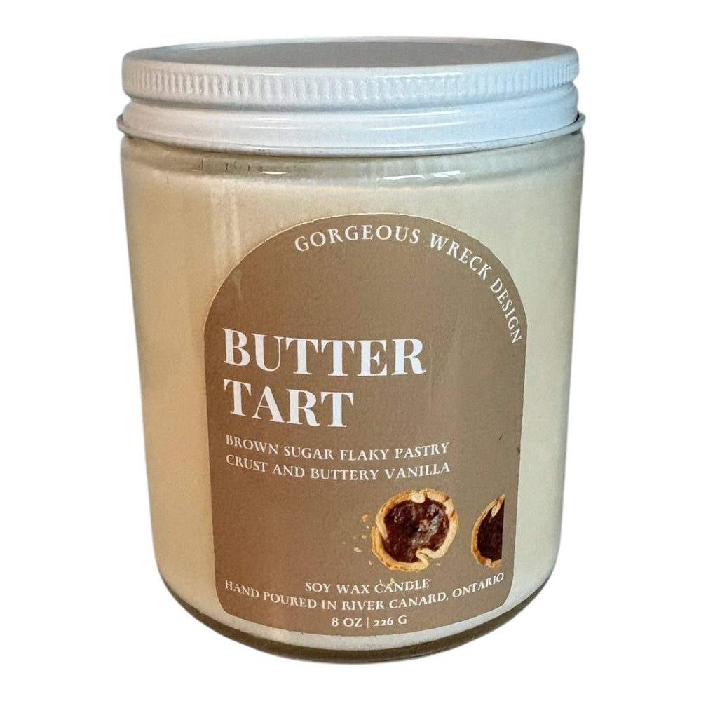 Jar of 'Butter Tart' candle with a label on a white background
