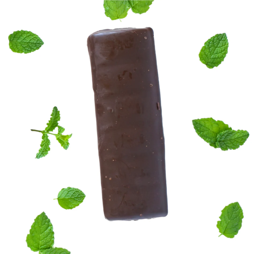 Chocolate bar with mint leaves on a white background
