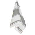 Gray Symmetry London dishtowel by Danica Brands, made of soft housewares fabric, displayed folded on a kitchen countertop.