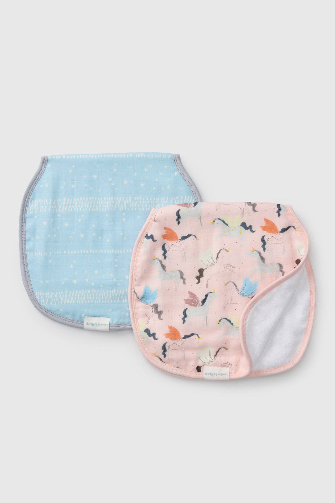 Two baby bibs, one blue with a subtle pattern and one pink with colorful designs, on a light gray background.