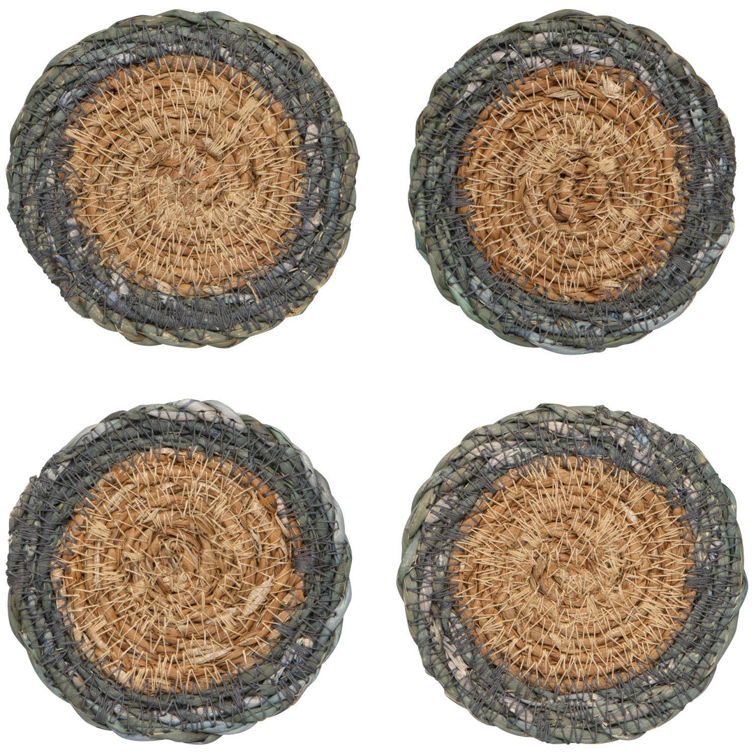 Four round woven coasters with a natural fiber design on a white background
