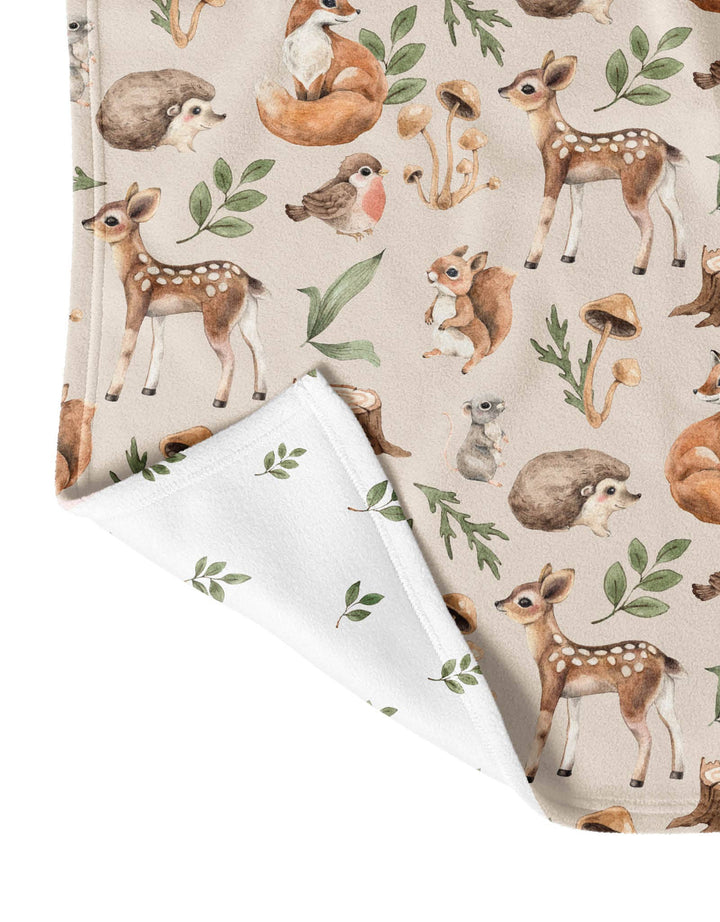 Woodland animal-themed fabric with deer, fox, and hedgehog on a beige background.
