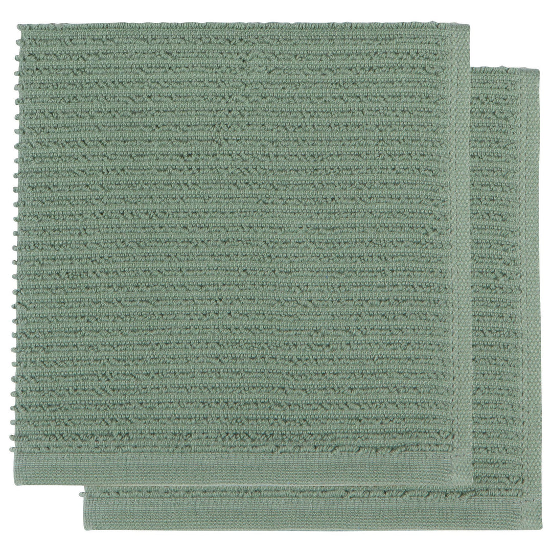 Two green textured bath mats on a white background