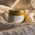 Sealuxe gold tin candle with anchor design, elegant scented candle in a metallic gold container for cozy ambiance.