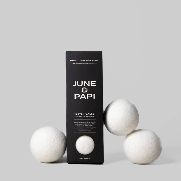 June &amp; Papi dryer balls with packaging on a gray background
