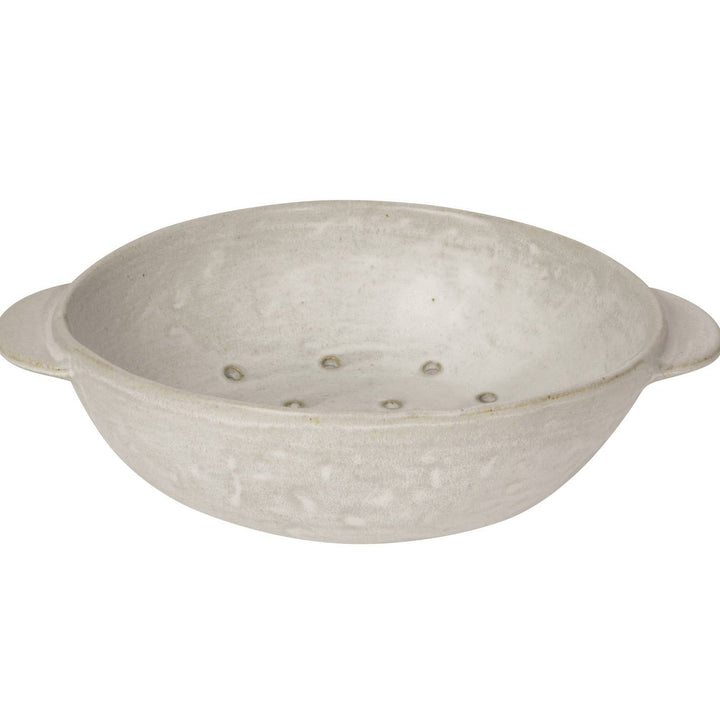 White ceramic colander with speckled texture on a white background
