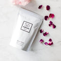 So Luxury Blush Soak bath bomb with pink and white swirls, featuring a luxurious, fragrant bath bomb for relaxing baths.
