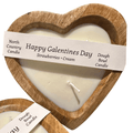 North Country Candle Strawberries & Cream candle with a white wax finish and a cotton wick, set on a wooden surface.